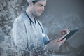 Composite image of surgeon using digital tablet Royalty Free Stock Photo