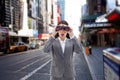 Composite image of surprised businesswoman looking through binoculars Royalty Free Stock Photo