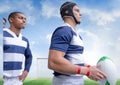 Composite image of team of diverse male rugby players against soccer field with copy space Royalty Free Stock Photo