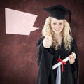 Composite image of teenage girl celebrating graduation with thumbs up Royalty Free Stock Photo