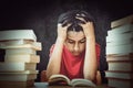 Composite image of tensed boy sitting with stack of books Royalty Free Stock Photo