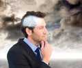 Composite image of thinking businessman touching his chin Royalty Free Stock Photo