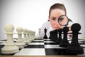 Composite image of thinking businesswoman with magnifying glass Royalty Free Stock Photo