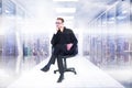 Composite image of thoughtful businessman sitting on a swivel chair Royalty Free Stock Photo