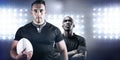 Composite image of tough rugby player holding ball Royalty Free Stock Photo