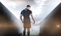 Composite image of tough rugby player holding ball Royalty Free Stock Photo