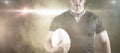 Composite image of tough rugby player holding ball Royalty Free Stock Photo