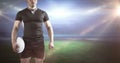 Composite image of tough rugby player holding ball Royalty Free Stock Photo