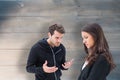 Composite image of unhappy brunette listening to boyfriend