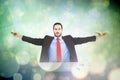 Composite image of unsmiling businessman sitting with arms outstretched Royalty Free Stock Photo
