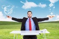 Composite image of unsmiling businessman sitting with arms outstretched Royalty Free Stock Photo