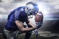 Composite image of upset american football player with ball Royalty Free Stock Photo