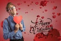 Composite image of valentines text and man holding a red heart