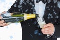 Composite image of welldressed man pouring champagne Royalty Free Stock Photo