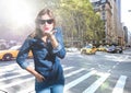 Composite image of Woman blowing kiss on street with flare Royalty Free Stock Photo