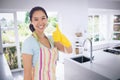 Composite image of woman in cleaning clothes giving thumbs up