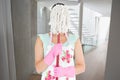 Composite image of woman hiding her face with a mop Royalty Free Stock Photo