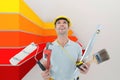 Composite image of worker holding various equipment over white background Royalty Free Stock Photo