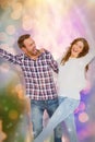 Composite image of young couple embracing and posing Royalty Free Stock Photo