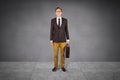 Composite image of young geeky businessman holding briefcase Royalty Free Stock Photo