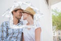 Composite image of young hip couple sitting on bench about to kiss