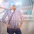 Composite image of young man with hand on hop wearing virtual reality simulator glasses Royalty Free Stock Photo