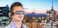 Composite image of young man wearing virtual reality simulator Royalty Free Stock Photo