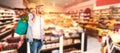 Composite image of young model holding bag with vegetables Royalty Free Stock Photo