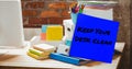 Composite of keep your desk clean on sticky note with office supplies and desktop on table Royalty Free Stock Photo