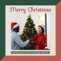 Composite of merry christmas text and diverse friends in santa hats decorating christmas tree