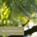 Composite of national take a walk in the park day text in gray rectangle over defocused trees