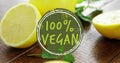 Composite of 100 percent vegan text over halved lemons