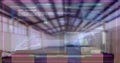 Composite of programming language, globe and multicolored graphs over empty warehouse