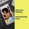 Composite of social media kindness day text over diverse people using smartphones