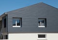 Black composite wood exterior siding for a house