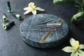 Composition with acupuncture needles on black table Royalty Free Stock Photo