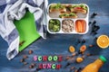 Composition with appetizing food and  words SCHOOL LUNCH made of color letters on wooden background Royalty Free Stock Photo
