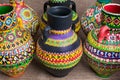 Composition of artistic painted clorful handcrafted pottery vases Royalty Free Stock Photo
