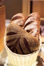 Composition with assorted bakery products in wicker basket. Royalty Free Stock Photo