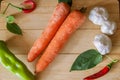 Composition with assorted raw organic vegetables. Detox diet, carrots, garlic and peppers. Royalty Free Stock Photo