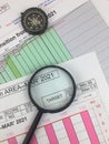 The composition of banknotes, magnifying glasses, compasses and also the distribution of data on graphs. Selective focus and