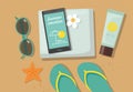 Composition with beach accessories. Sunglasses, towel, sun block, flip-flops and phone on sandy beach