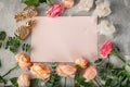 Composition with beautiful flowers and blank card on grey background Royalty Free Stock Photo