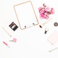 Composition for beauty blog with pink roses bouquet, cosmetics, diary and clipboard on white background. Top view. Flat lay, copy Royalty Free Stock Photo