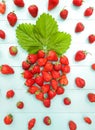 Composition of big figure strawberry is laid out of strawberries with green leaf. Freshly berries, sunny summer day. Ripe red Royalty Free Stock Photo
