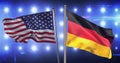 Composition of billowing american flag and german flag against wall of spotlights