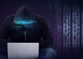 Composition of binary coding and data processing over hacker in hood using laptop Royalty Free Stock Photo
