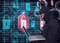 Composition of binary coding and online security padlocks over hacker in hood using laptop Royalty Free Stock Photo
