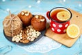 Composition of biscuits, cup of tea and lemon on the vintage background. Royalty Free Stock Photo