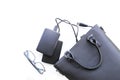 Composition with black bag, hard disks and glasses Royalty Free Stock Photo